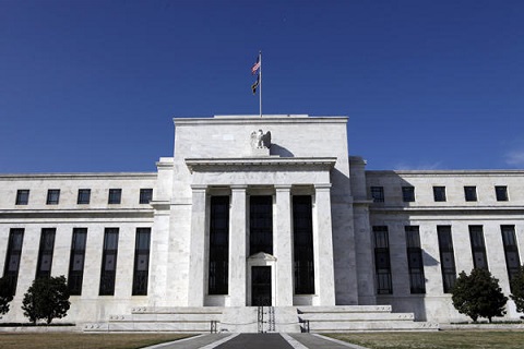 Fed delivers, but lowers forecast for this year; Dollar down