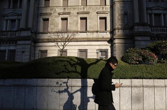 BOJ cuts inflation forecast, expands loan scheme instead of QQE
