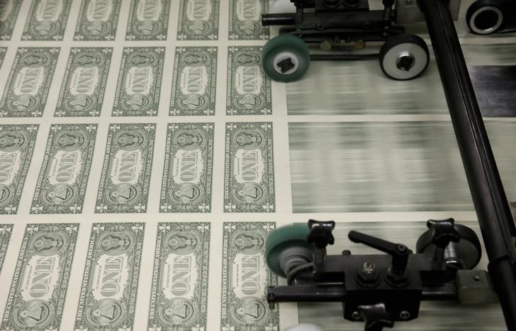 Dollar slides broadly lower ahead of U.S. economic reports