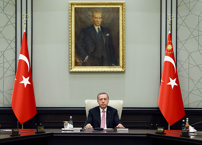 This handout picture taken and released on July 20, 2016 by Turkish Presidential Press Office shows Turkish President Recep Tayyip Erdogan chairing a meeting of the National Security Council (MGK) at the Presidential Palace in Ankara. Turkish President Recep Tayyip Erdogan today chaired a crunch security meeting for the first time since the failed coup, after a widening purge that has seen around 50,000 people either detained or sacked. / AFP / TURKEY'S PRESIDENTIAL PRESS SERVICE / KAYHAN OZER        (Photo credit should read KAYHAN OZER/AFP/Getty Images). Turkish