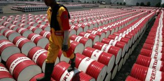 Oil falls in holiday-thinned trade on supply glut concerns