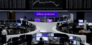 Banks lift stocks, dollar holds near 14-year peak Banks lift stocks, dollar holds near 14-year peak