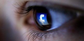 Facebook loses first round in suit over storing biometric data A picture illustration shows a Facebook logo reflected in a person's eye, in Zenica